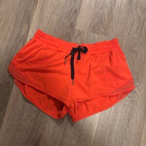 Orange lululemon running shorts